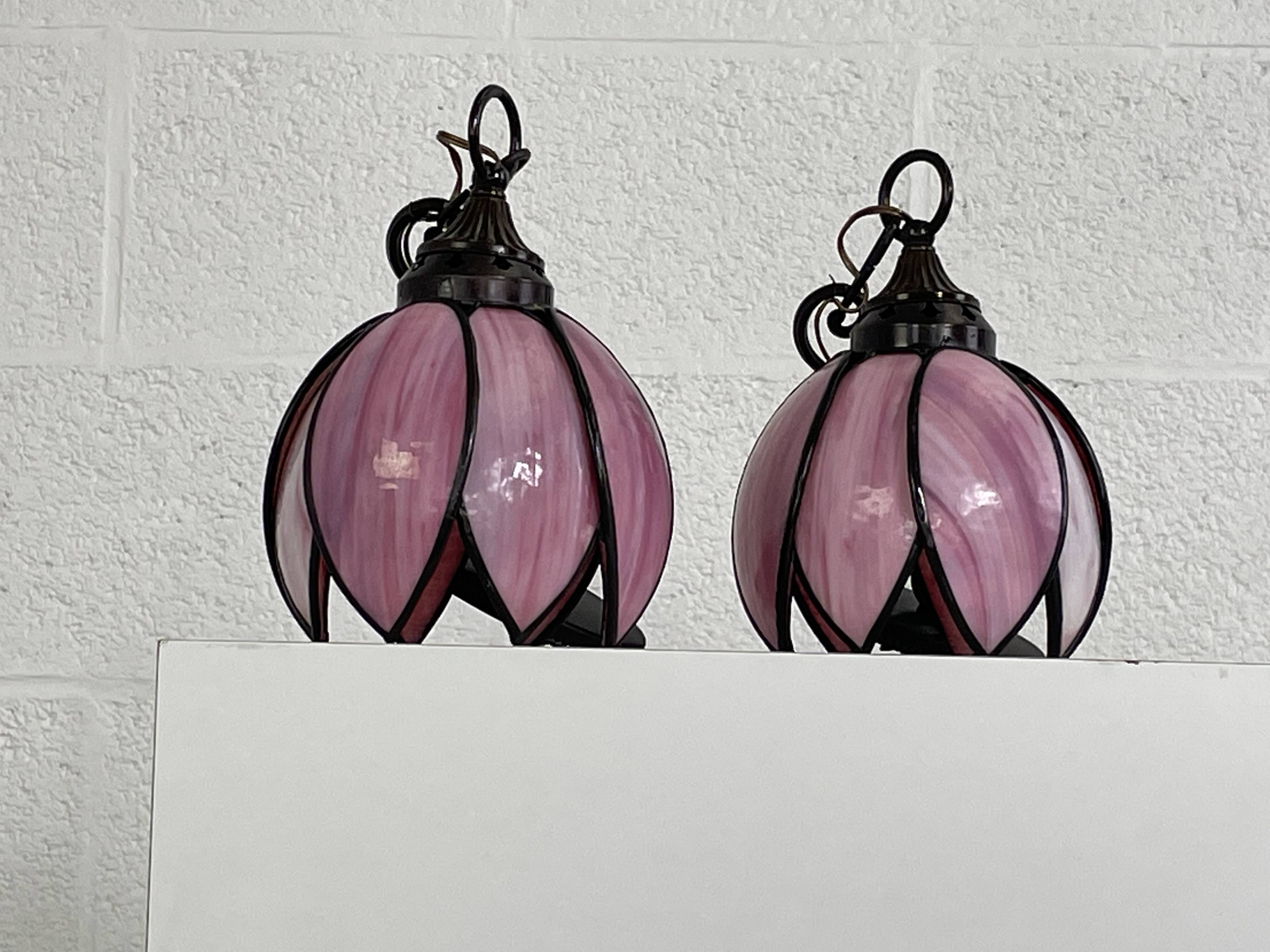 pair of iron wall lamps and Tiffany style glass legs