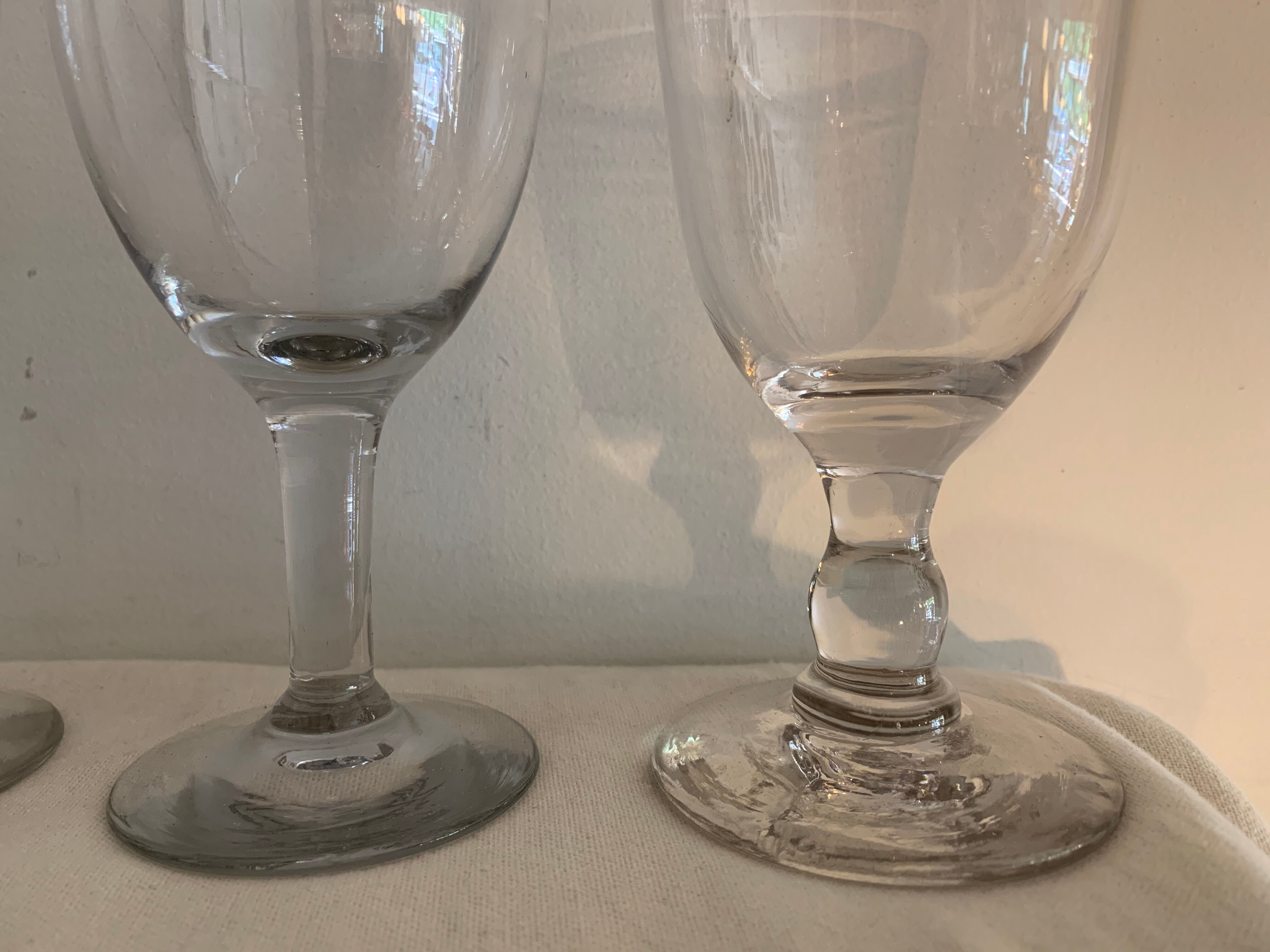 8 old blown and different foot wine glasses