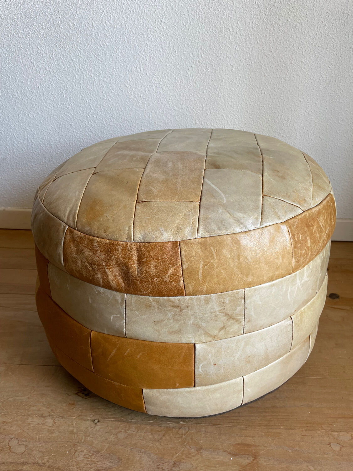 Brown and beige patchwork leather pouf from sede