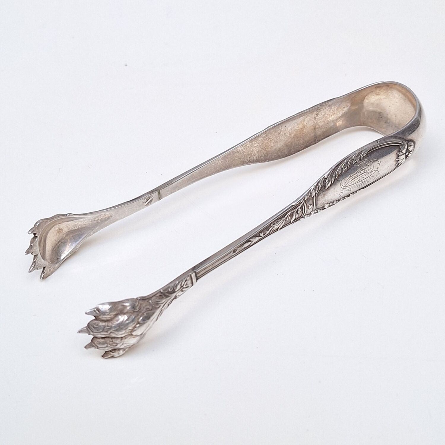 Solid silver sugar or ice tongs with lion's paw decoration