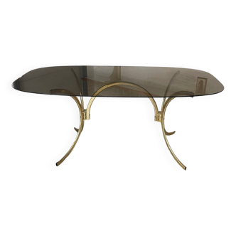 70s design table with smoked glass and golden tubular metal