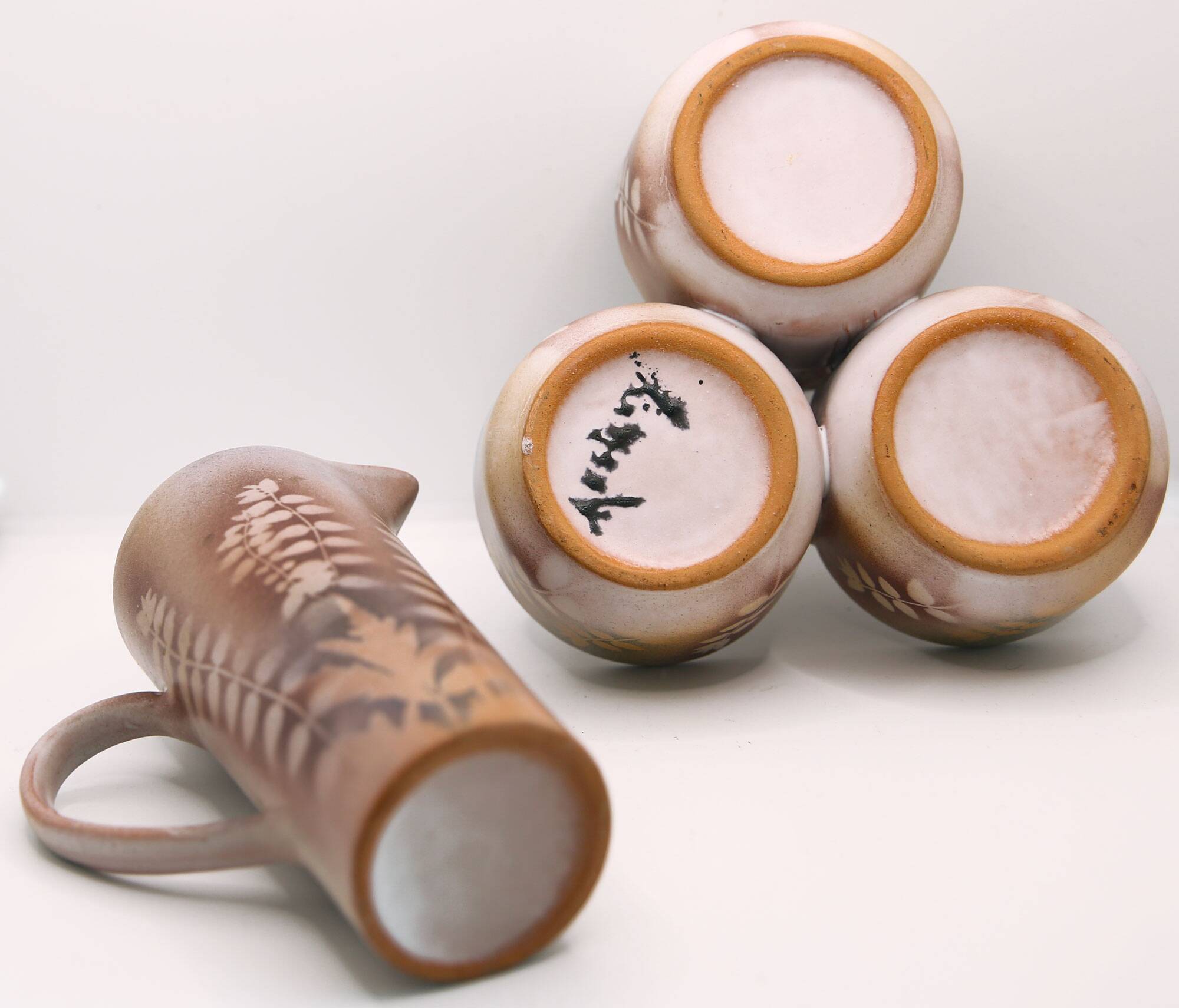 Lot of a pitcher and bowl with old pink flowers by Jean Austruy