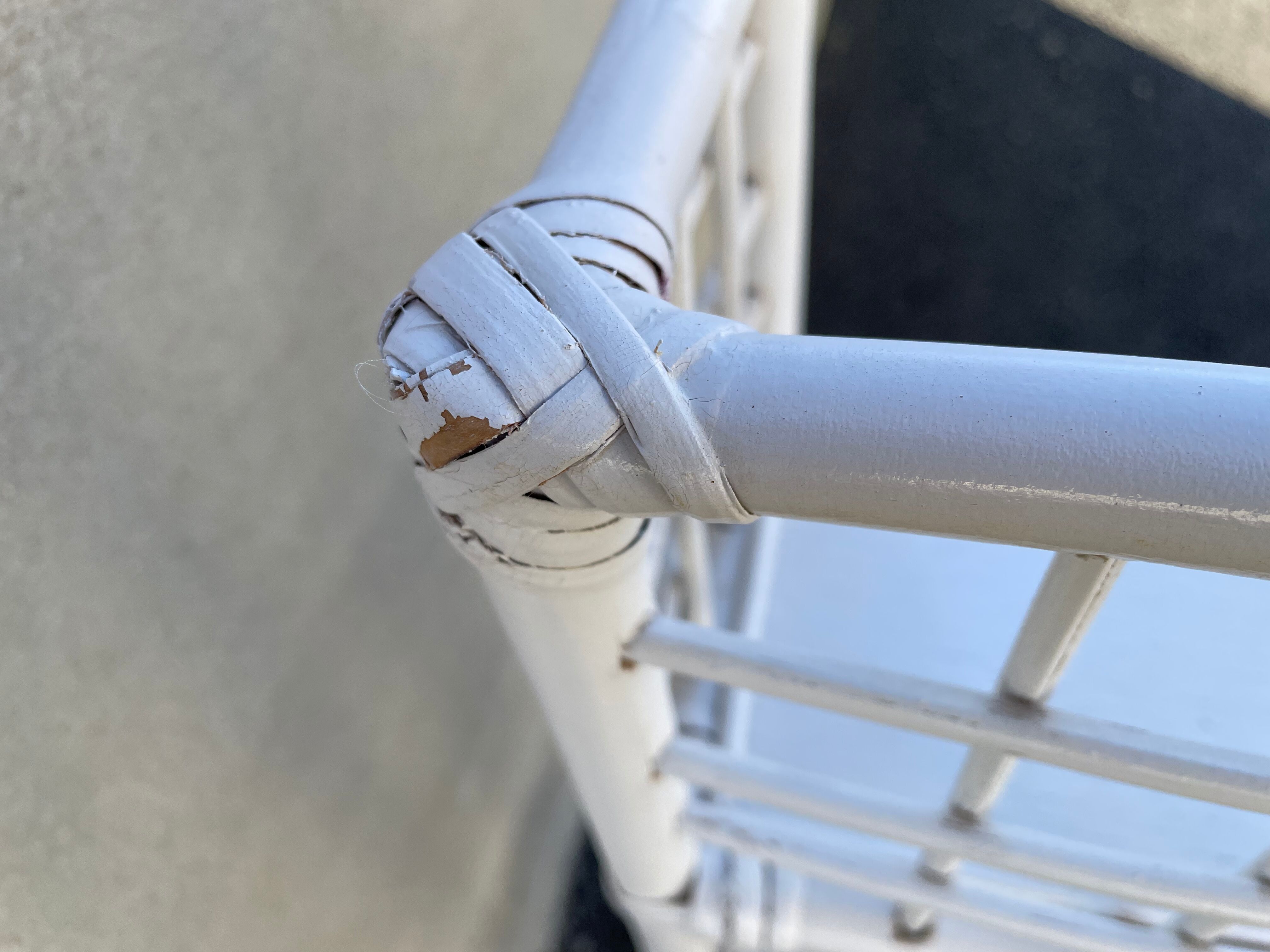 White rattan shelf with braces