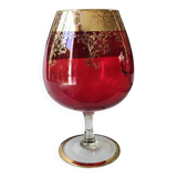 Vase in the shape of a footed cup, in bohemian crystal. ruby color. scroll & floral design with 24 c gold highlights