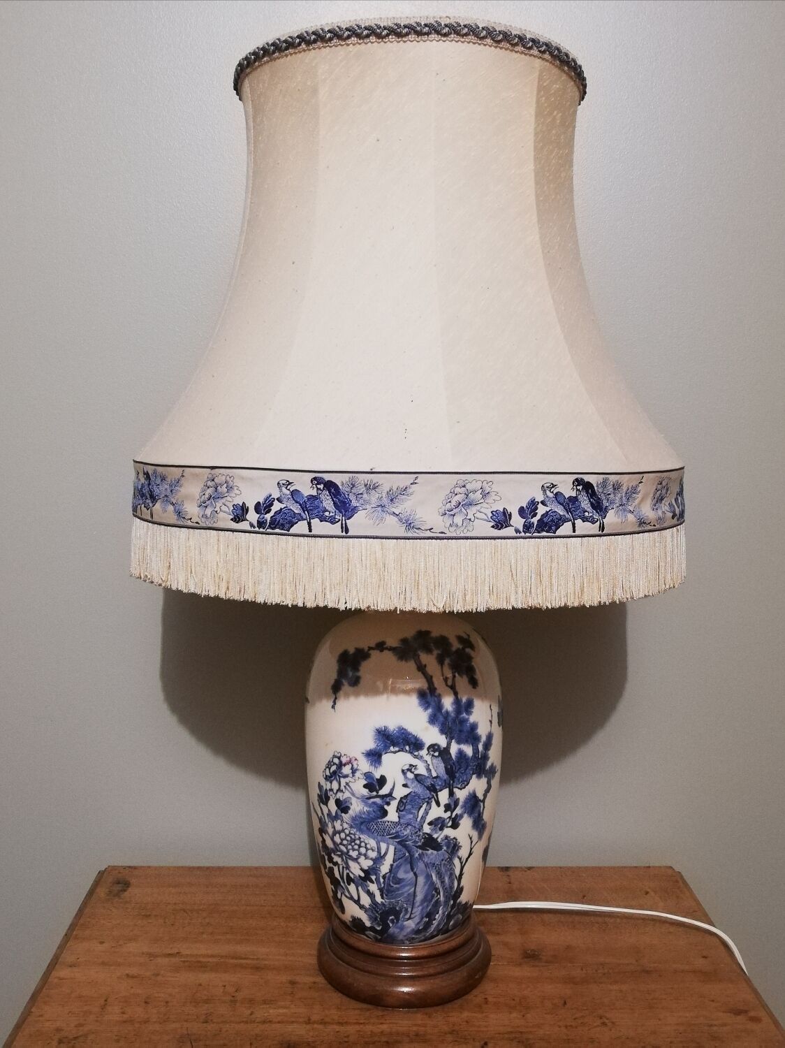 Ceramic lamp with Asian decoration with matching lampshade.