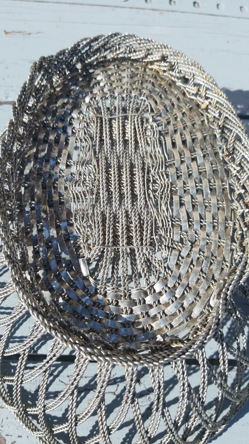 flat basket cut center table in woven metal