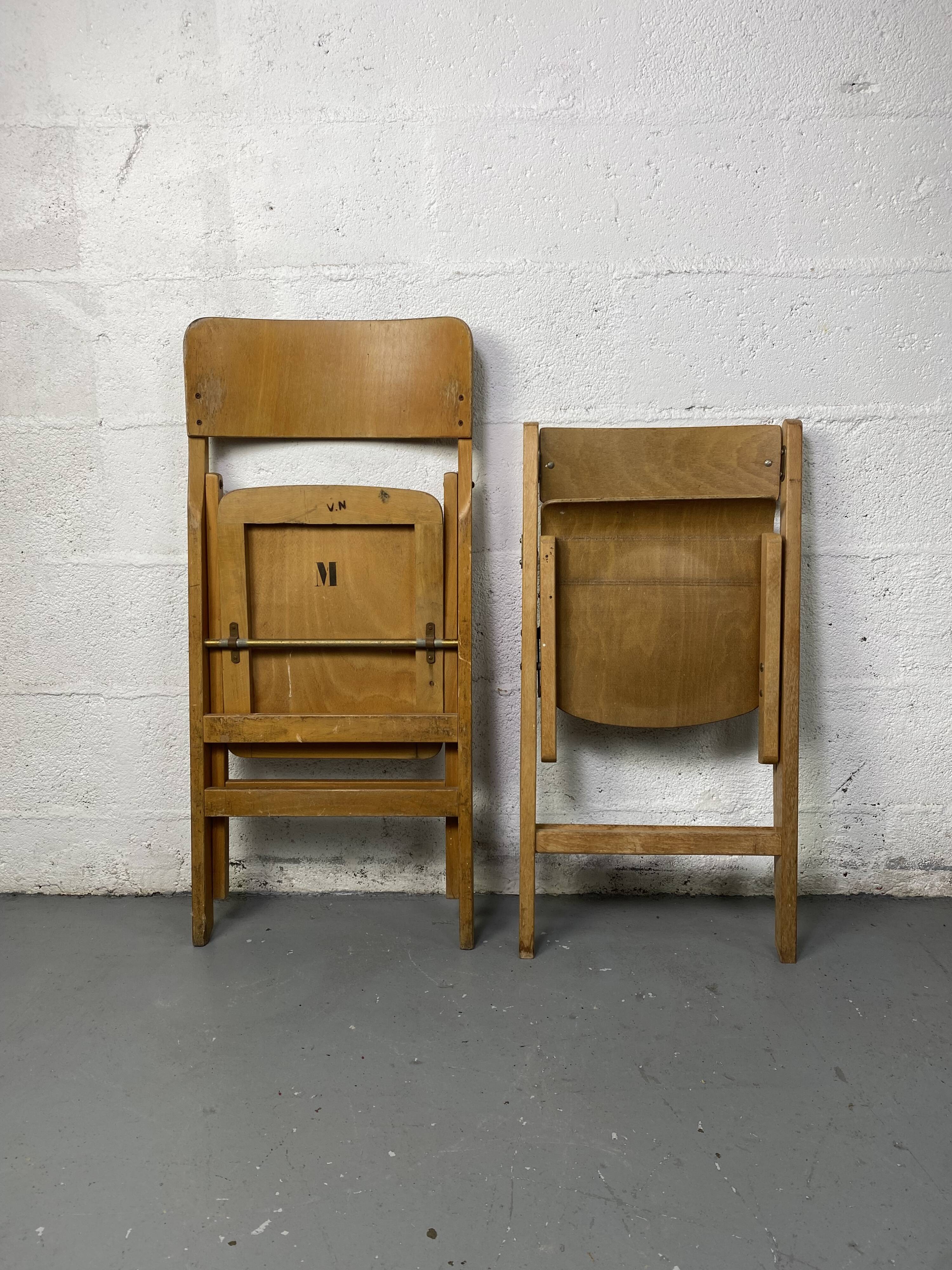 Pair of mismatched wooden folding chairs