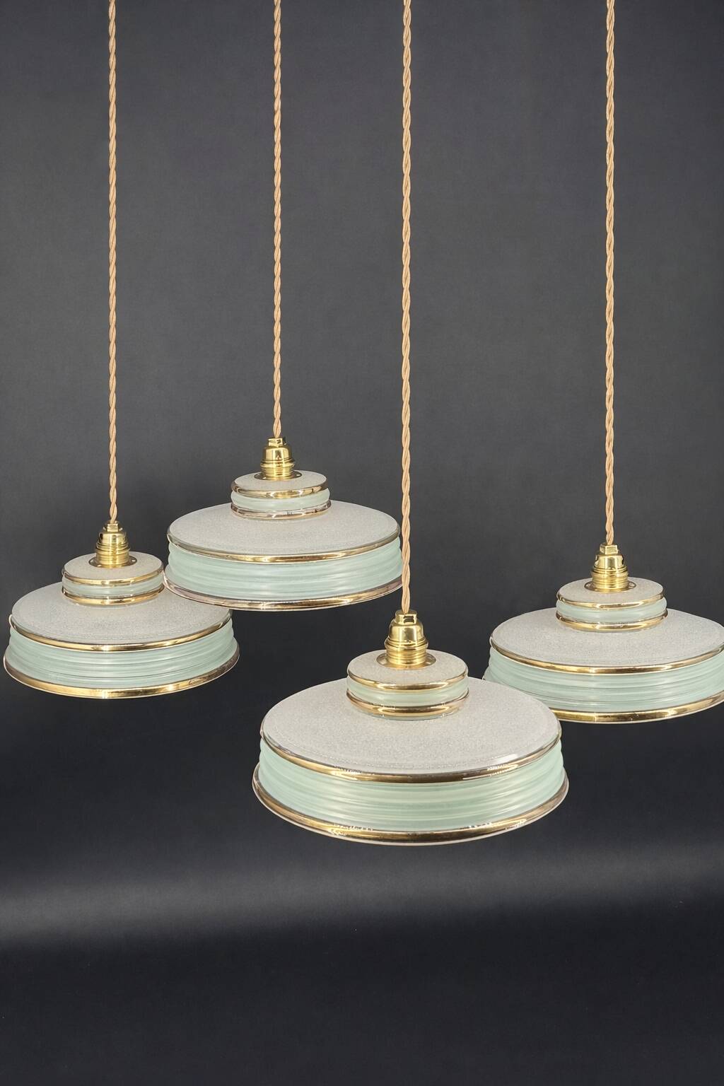 Set of 4 Art Deco pendant lights in frosted water green and gold.