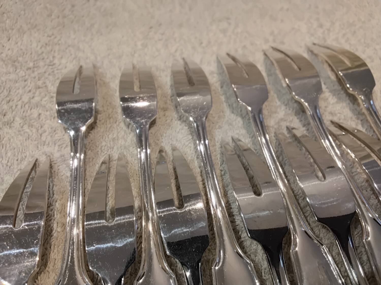 12 silver-plated metal snail forks by silversmith Noel Collet, shell design