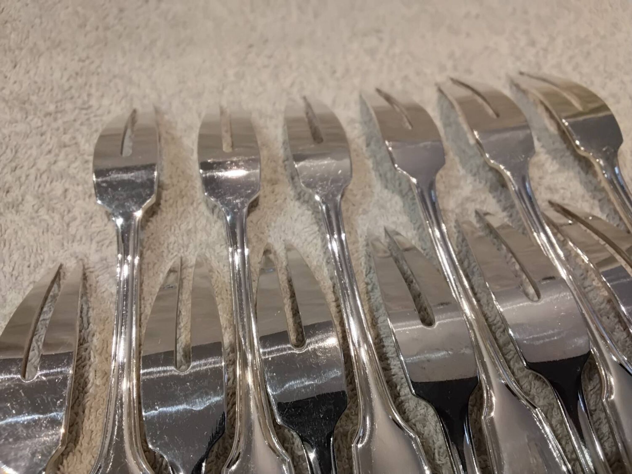 12 silver-plated metal snail forks by silversmith Noel Collet, shell design