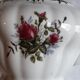 Musical teapot in white porcelain with floral decoration