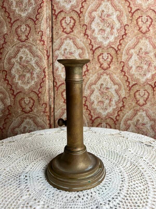 Patinated gilt brass candlestick