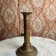 Patinated gilt brass candlestick