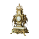 Pendule triptyque aux "Amours de Bacchus" en bronze a patine brune.