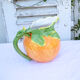 Pitcher in an orange-shaped slurry