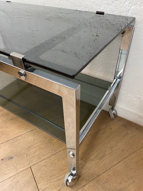 Vintage coffee table on chrome wheel and smoked glass