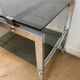 Vintage coffee table on chrome wheel and smoked glass