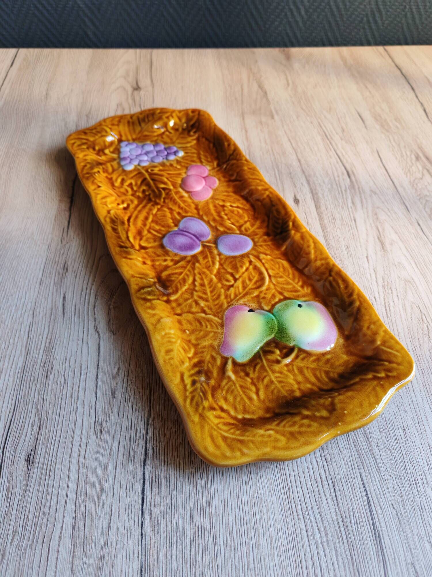 Vintage barbotine pocket dish from Salins les Bains, relief decoration of fruits.