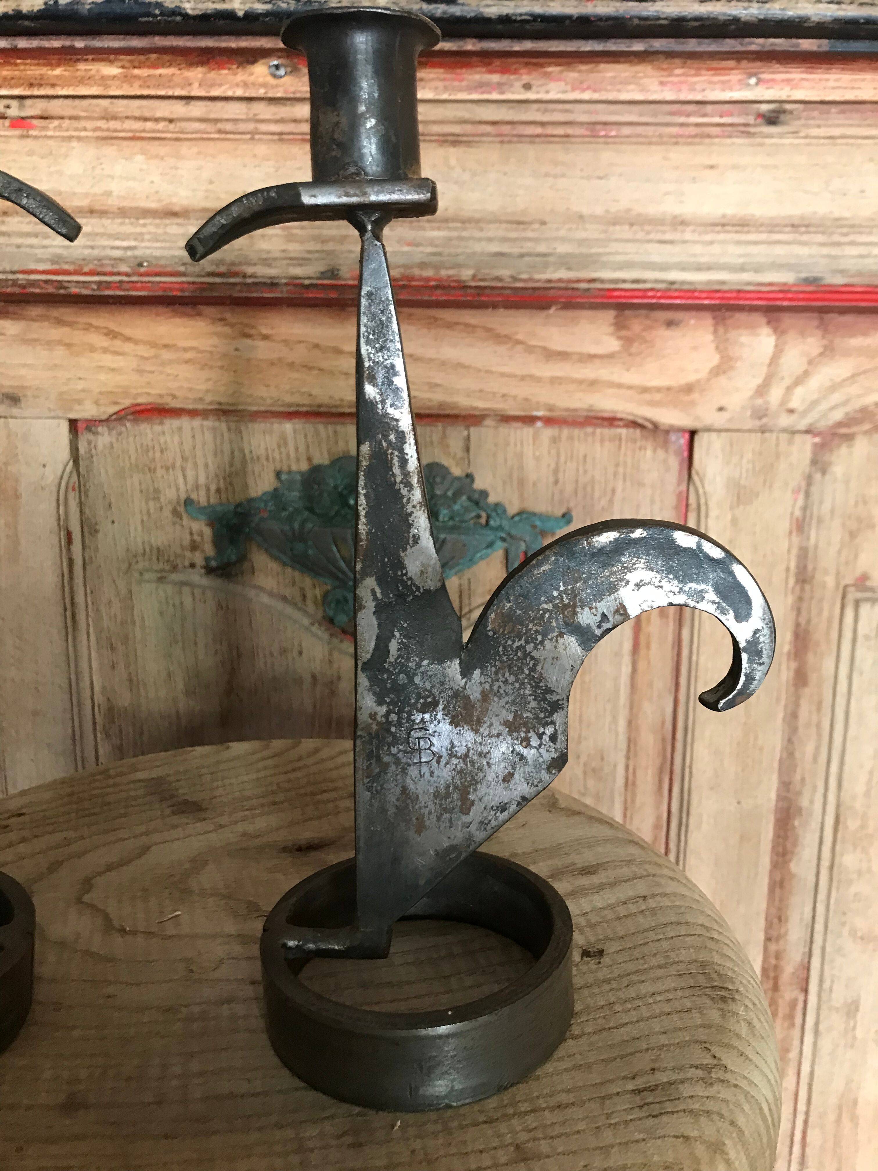 Signed zoomorphic iron candle holders