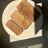 Trio of rounded rectangular trays or cups in monoxyl teak L:35