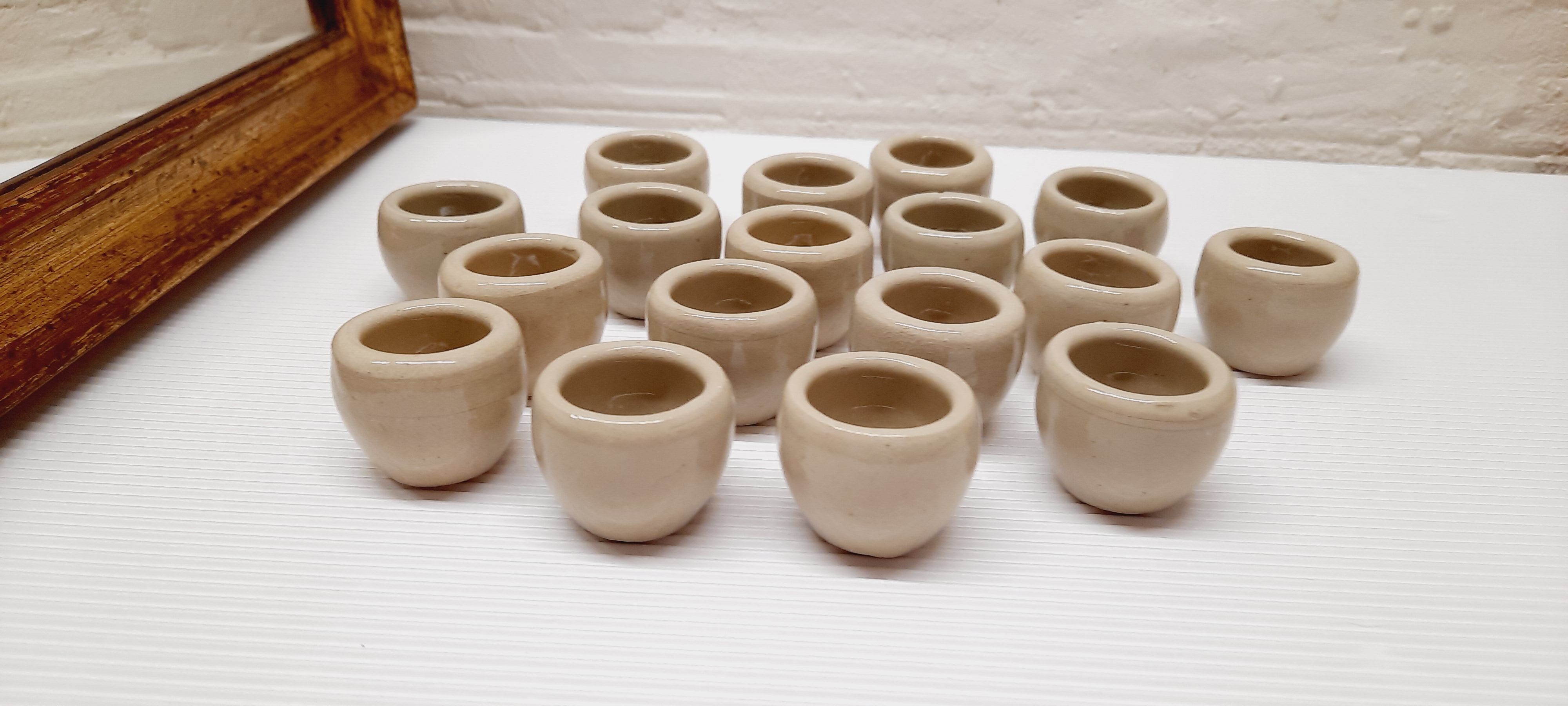 Set of 17 buckets sandstone snails