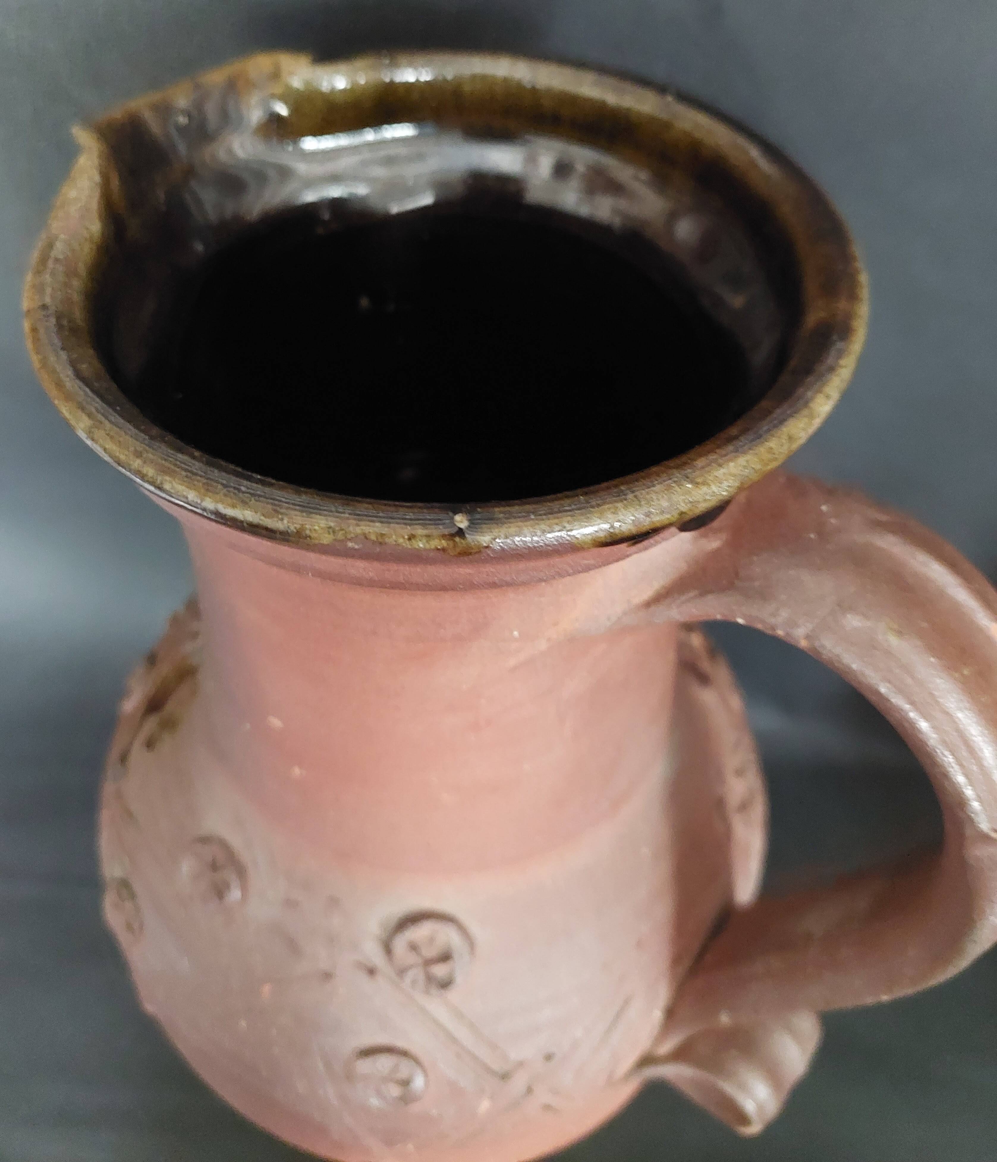 Vintage pitcher with a signature to identify.