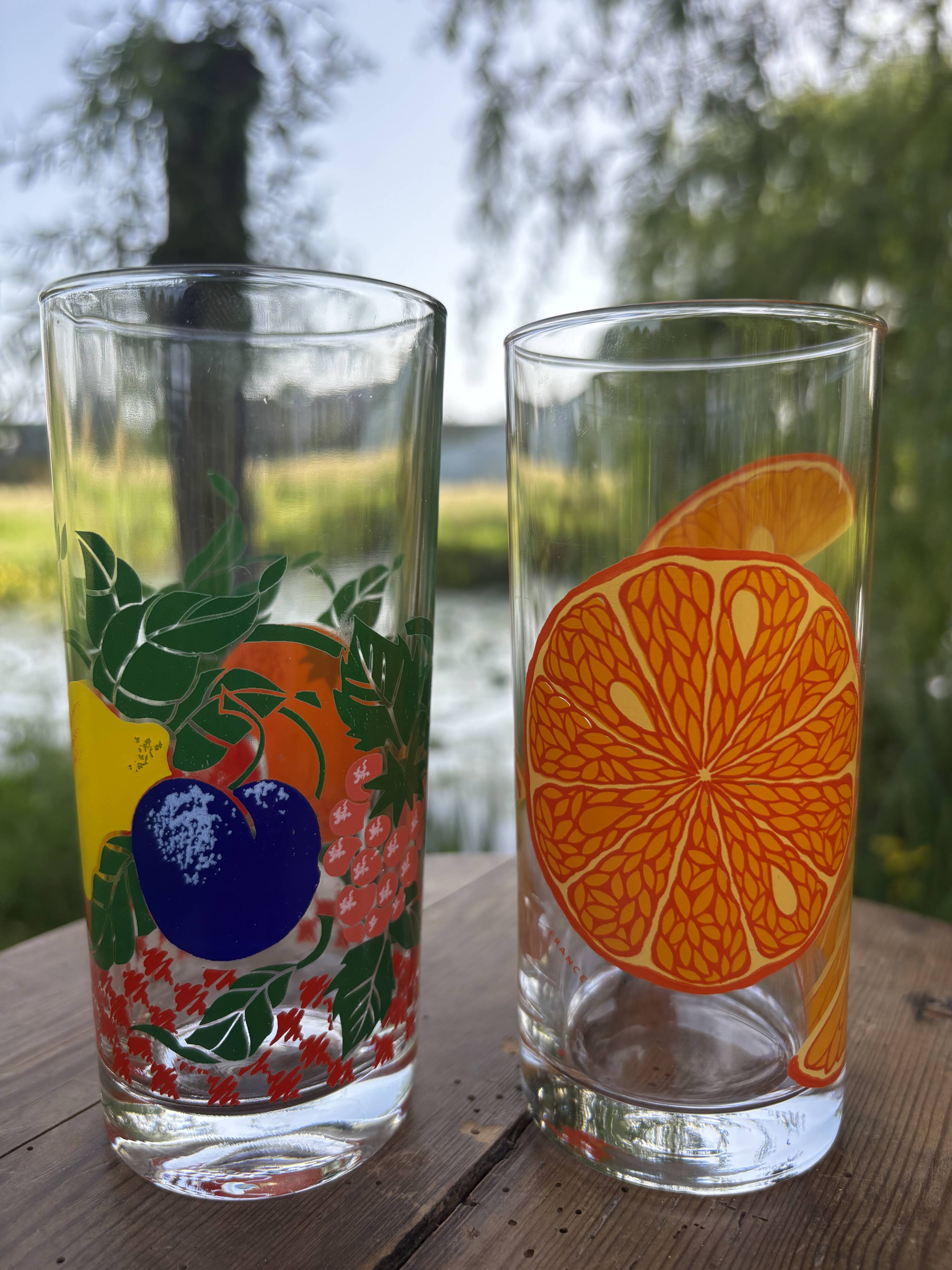 Vintage set of 4 fruit-decorated orangeade glasses.