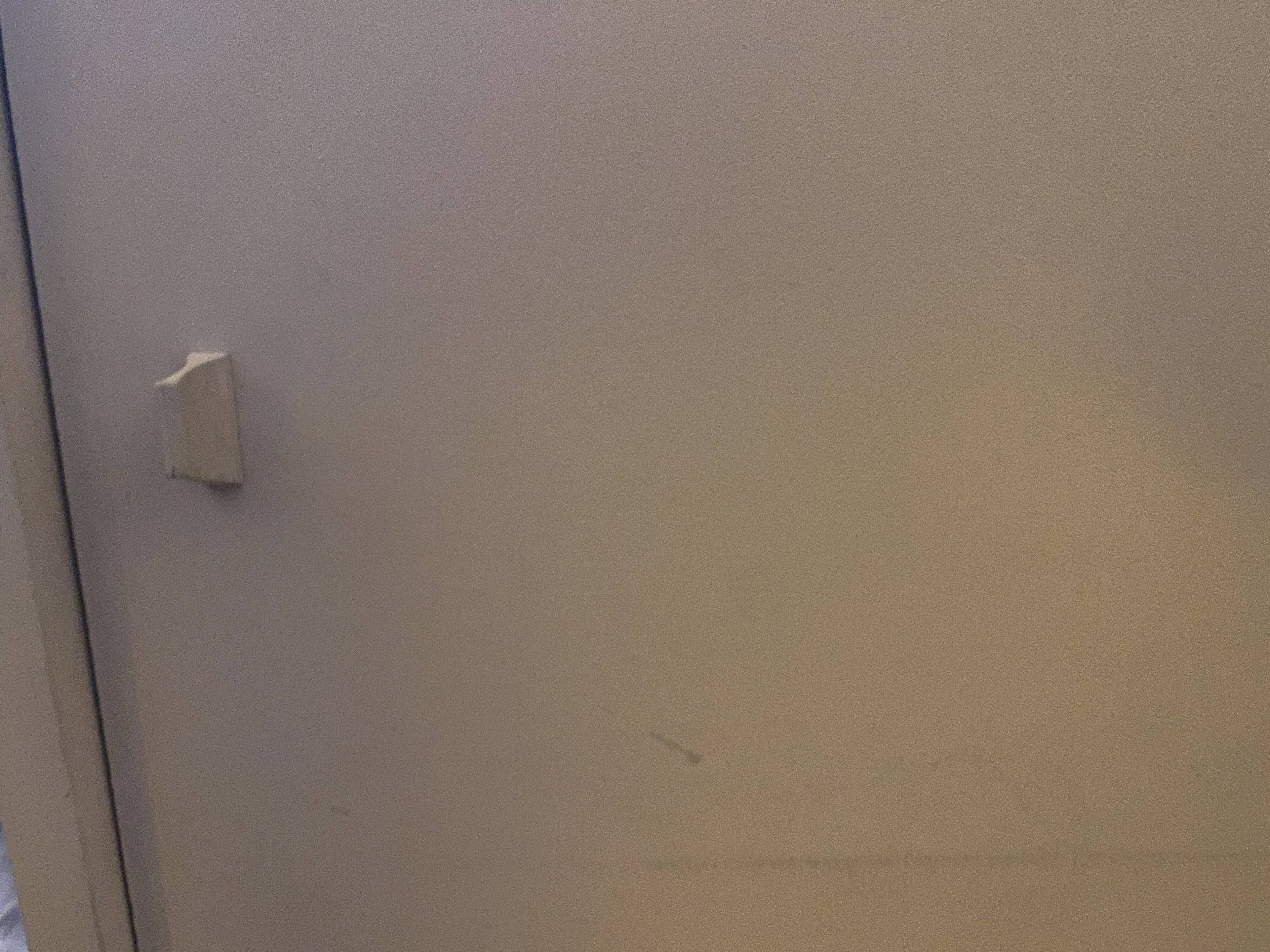 Beige wooden bookshelf