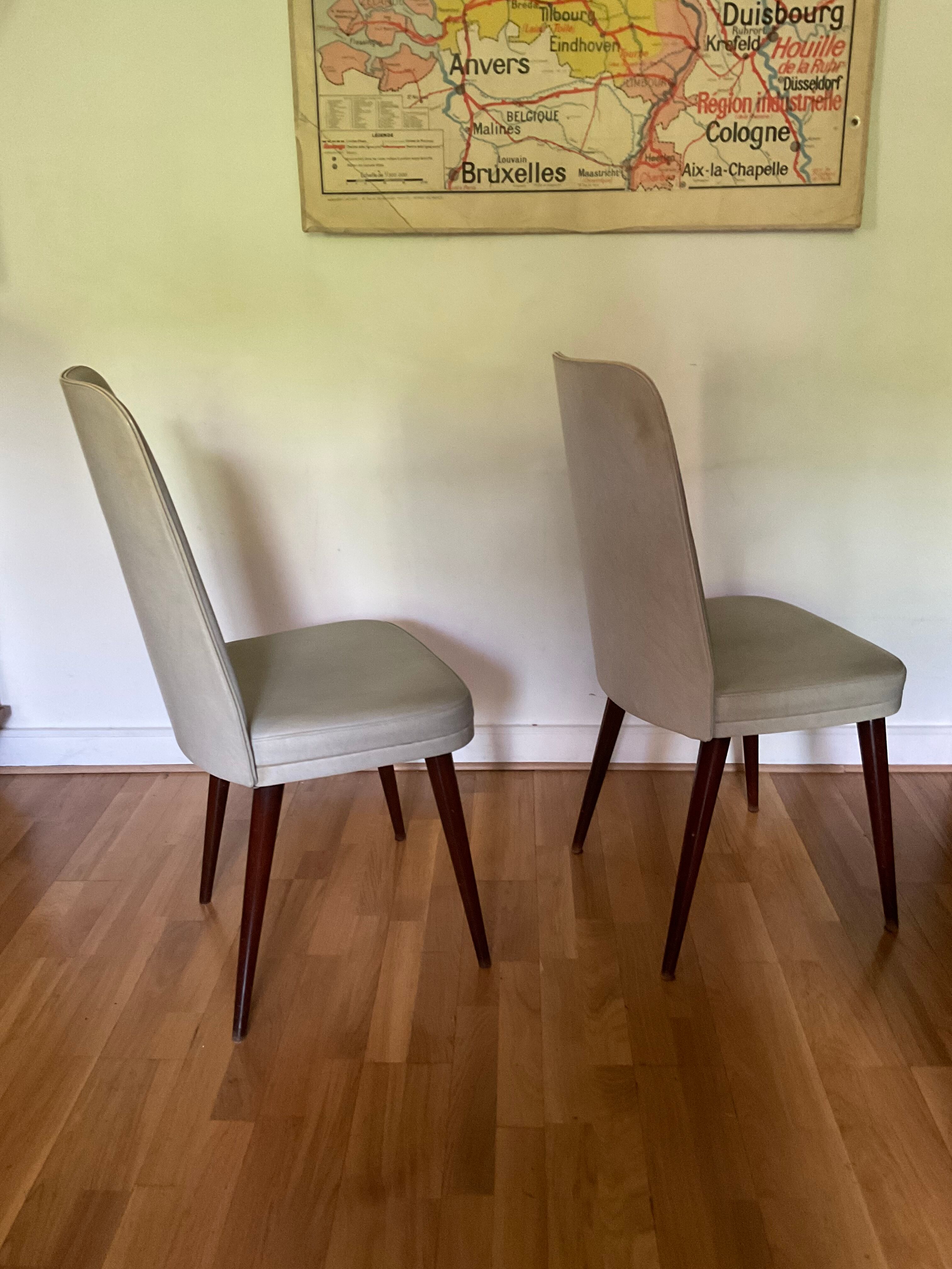 Pair of vintage mahogany and skai chairs