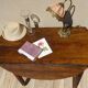 Antique walnut console table with honey spoon legs.