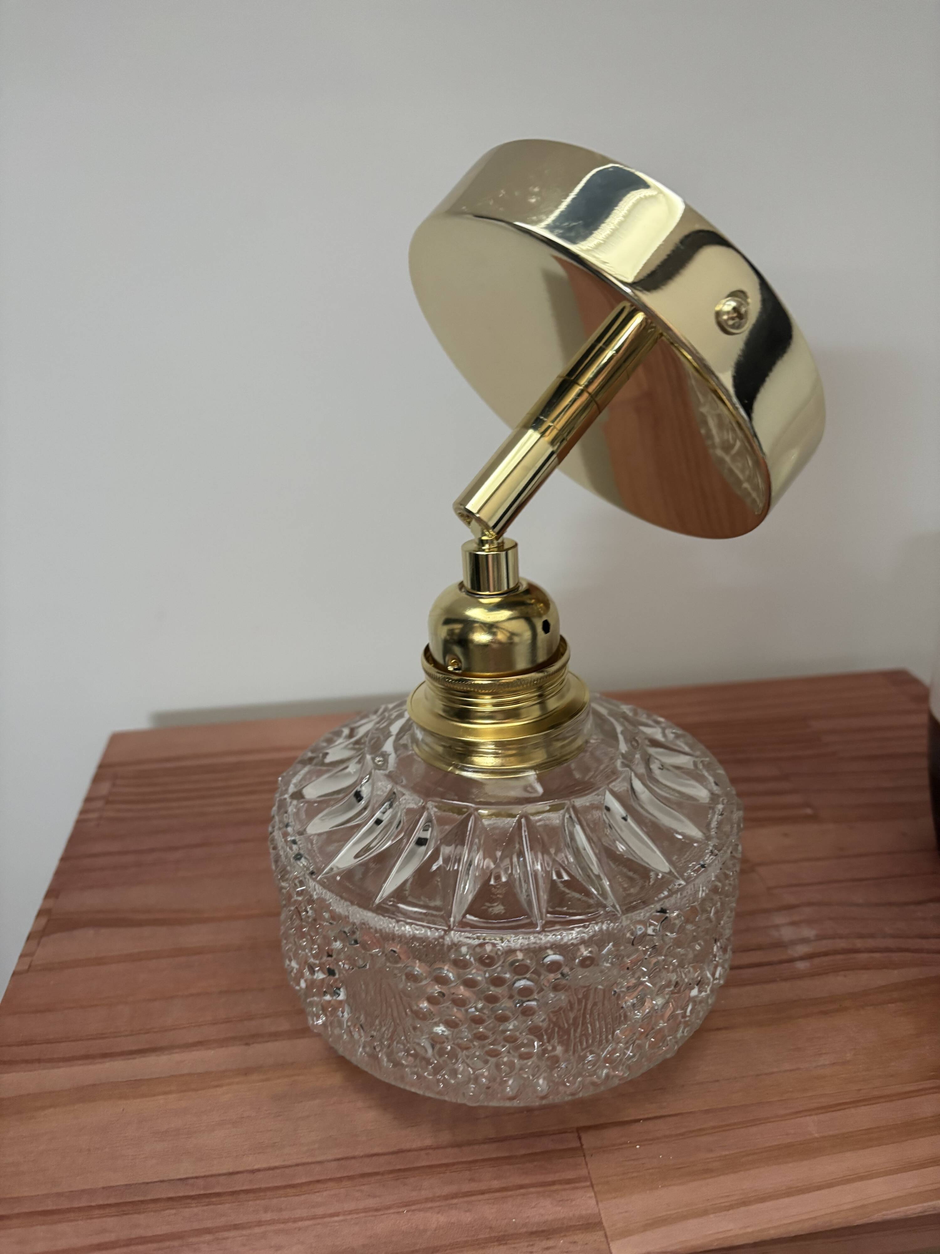 Gold tilting wall light