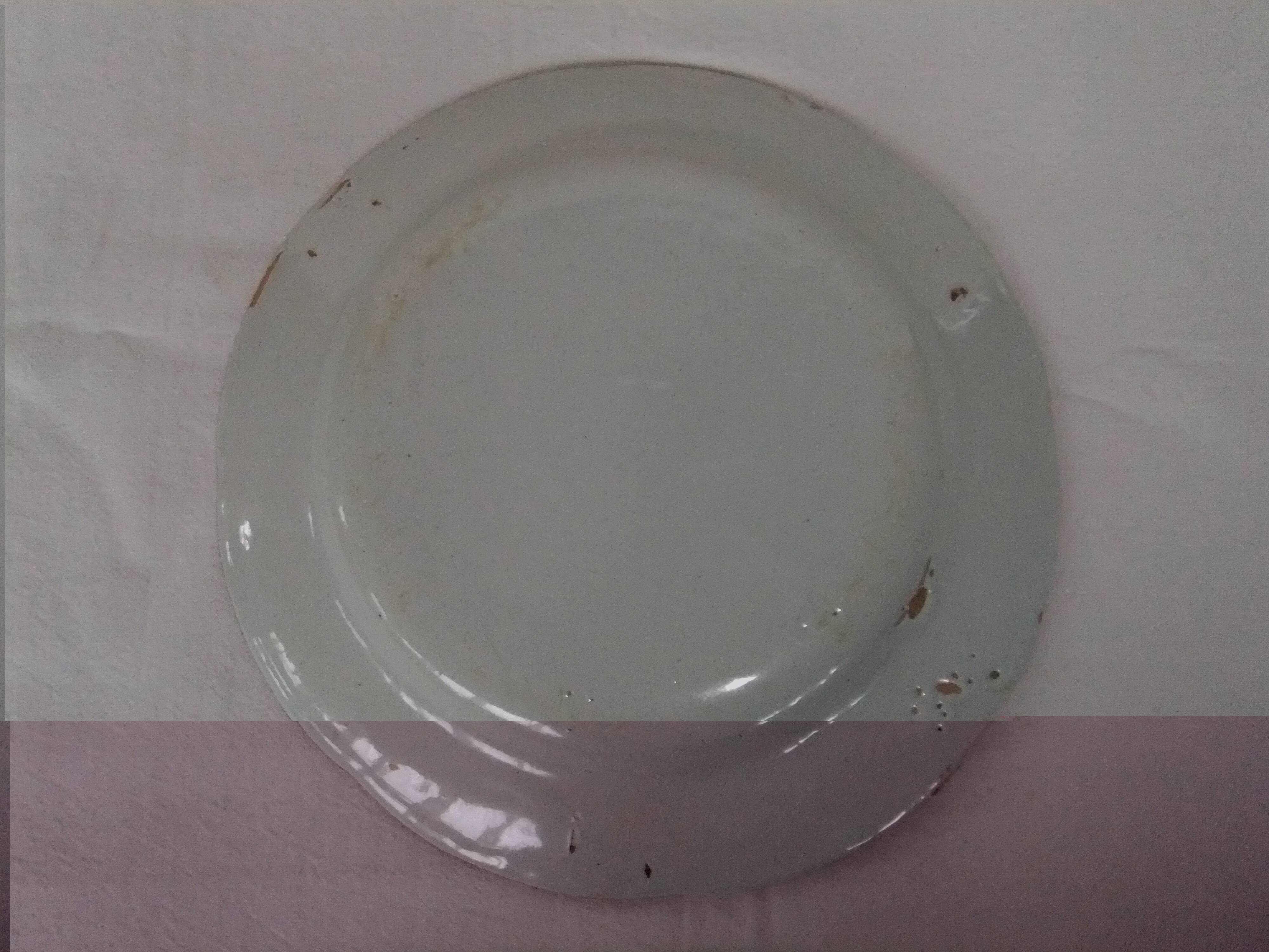 Old earthenware plate of the East Strasbourg decorated with flowers