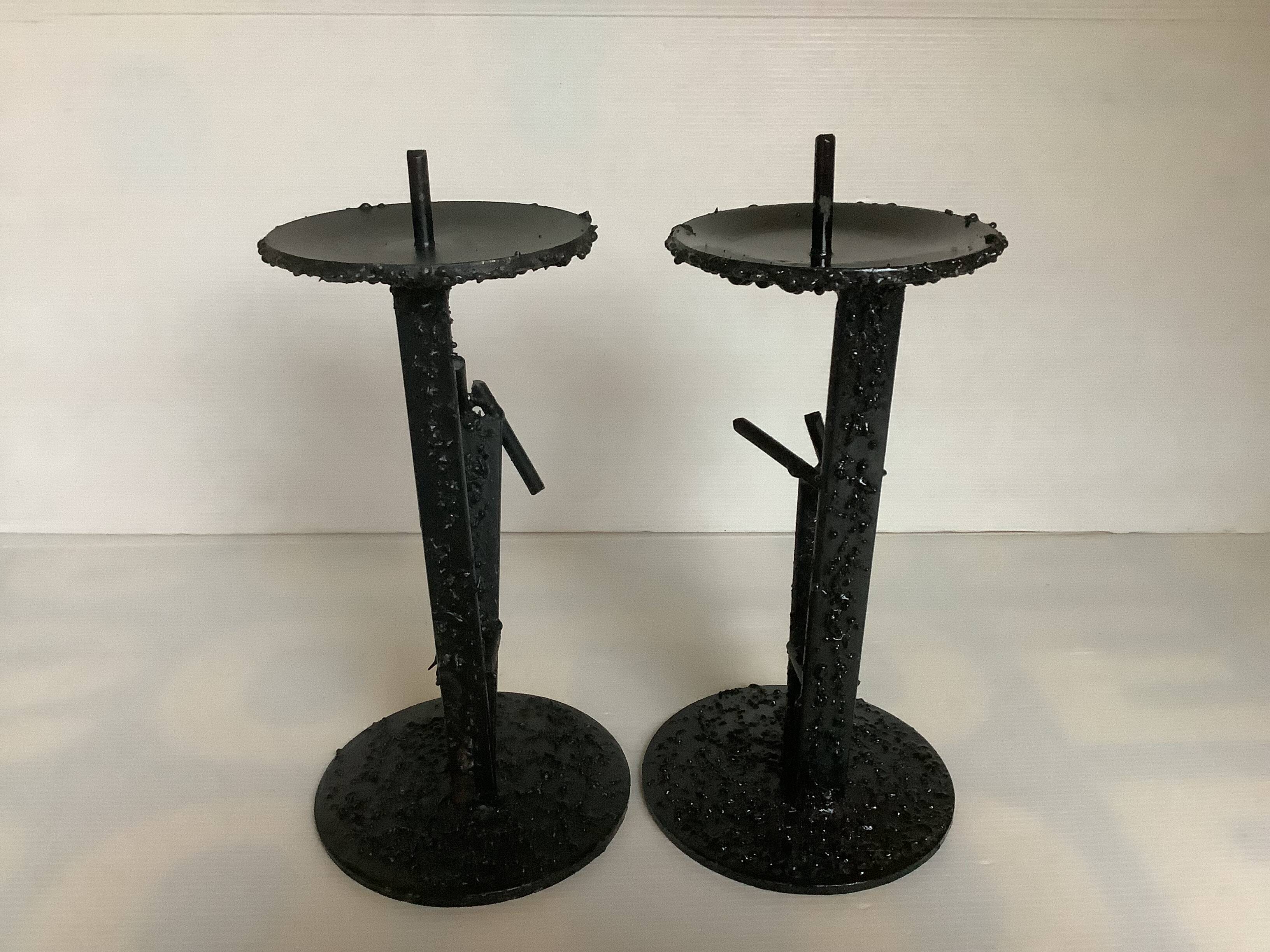 Pair of black metal candlesticks