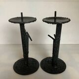 Pair of black metal candlesticks