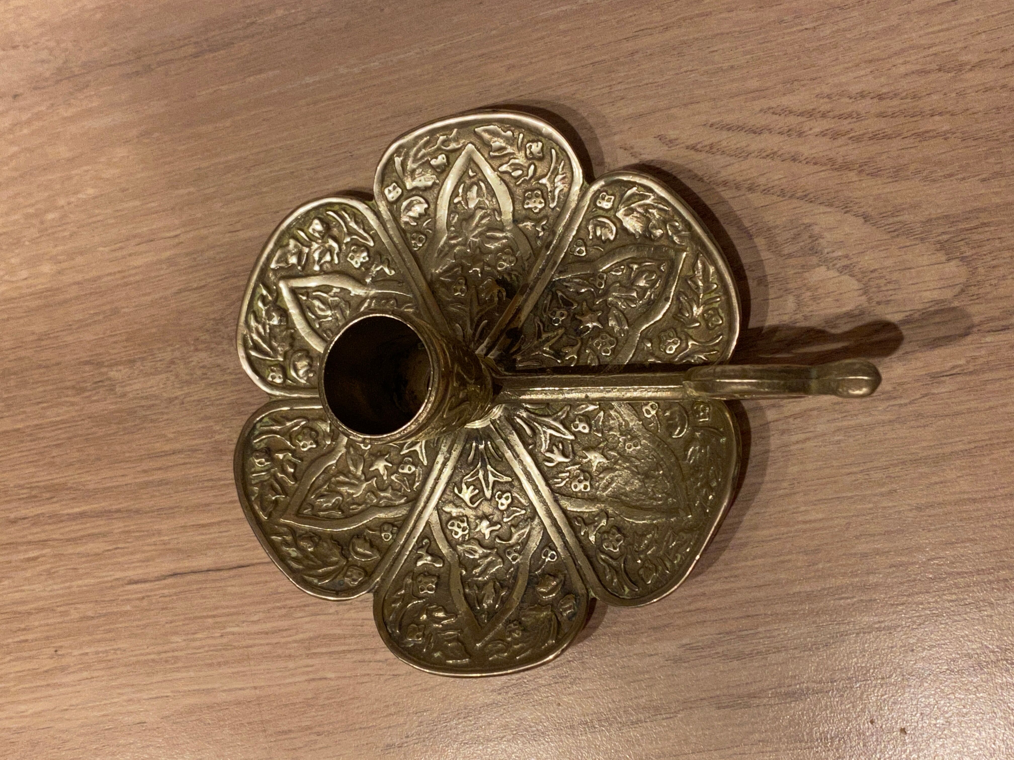 Brass candle holder on frame