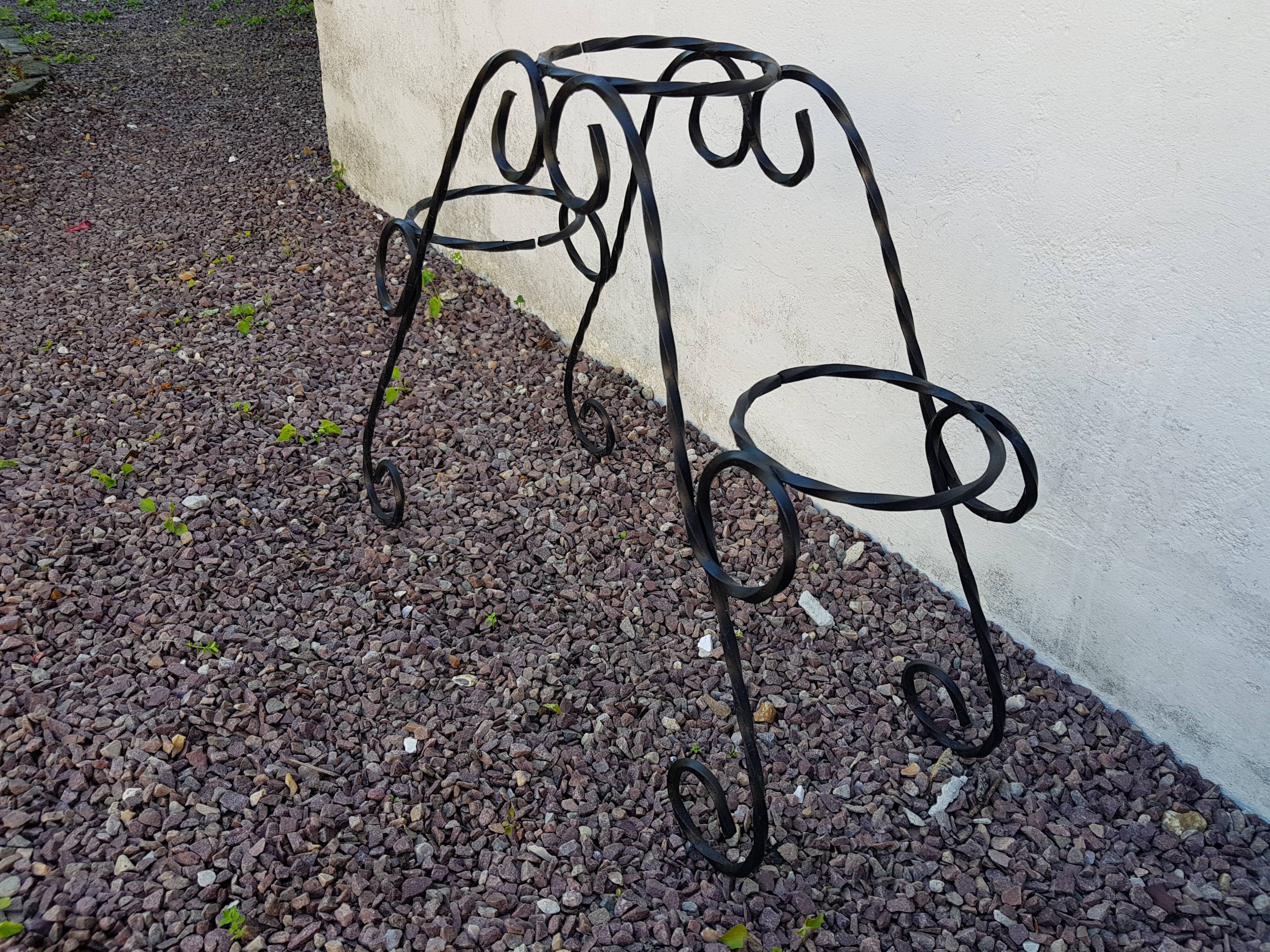 Black wrought iron plant holder