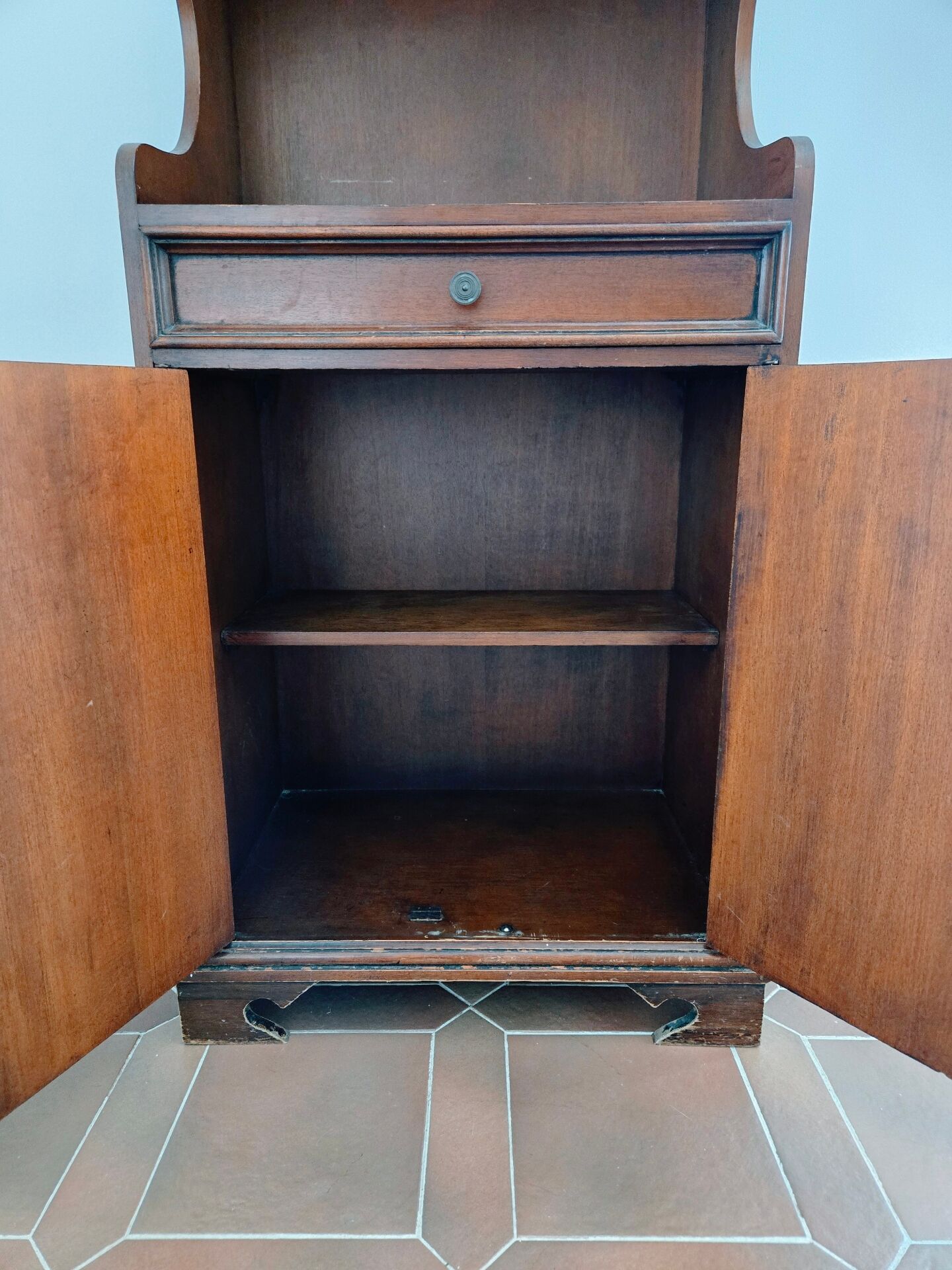 Small antique accent table made of solid wood.