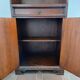 Small antique accent table made of solid wood.