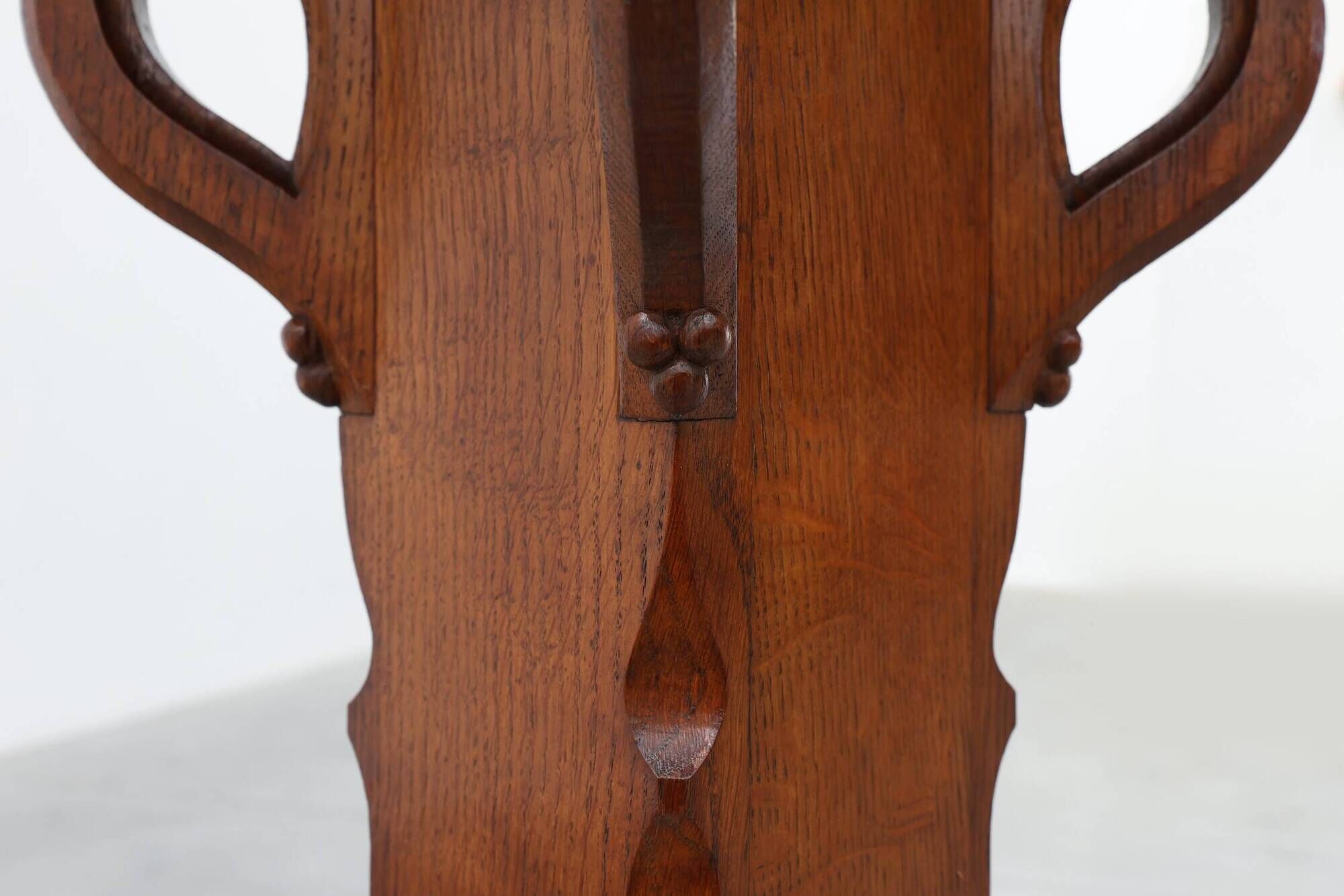 Art Deco oak pedestal with pierced brackets and cross base, Belgium 1920s