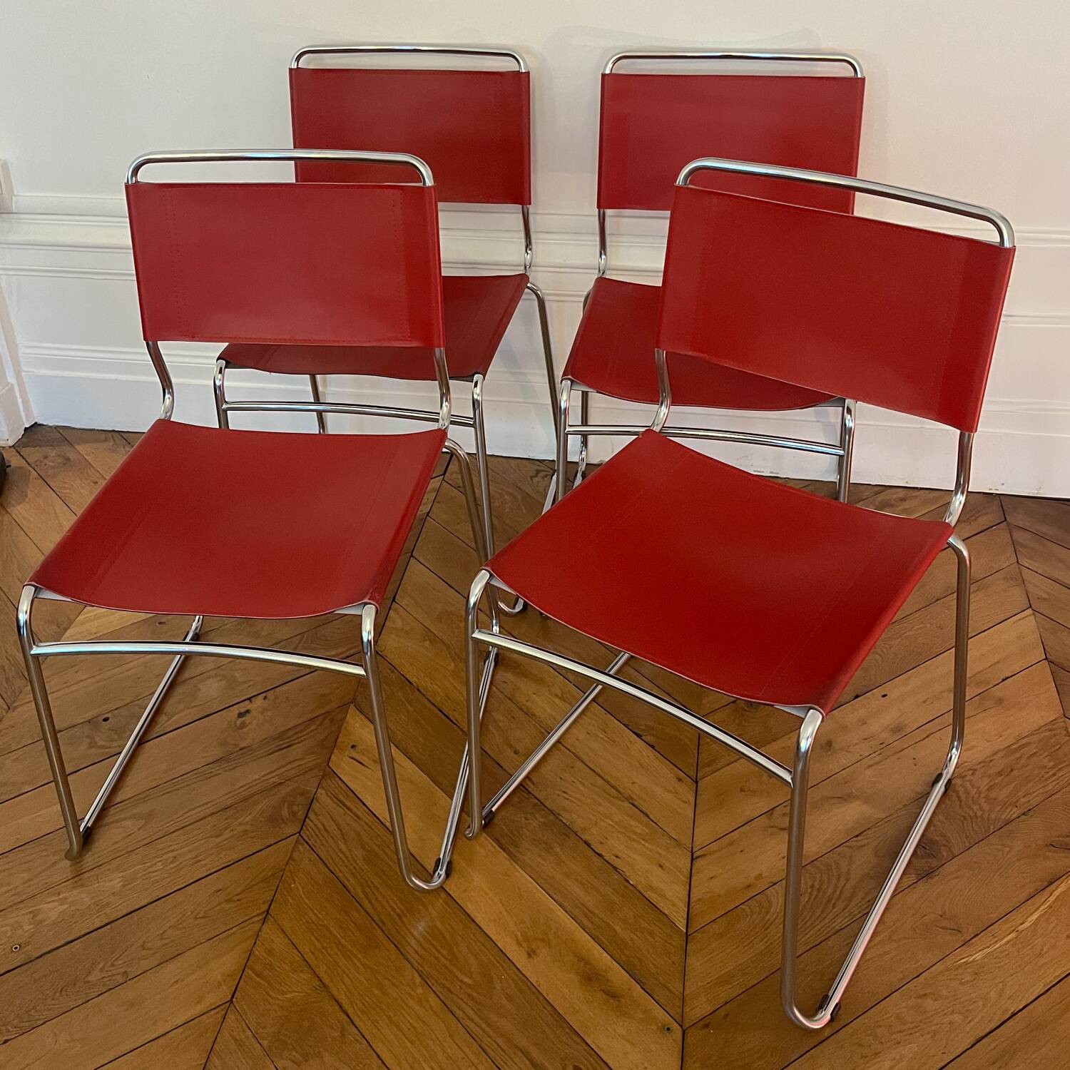 Set of 4 chairs in red leather and chrome tubular metal