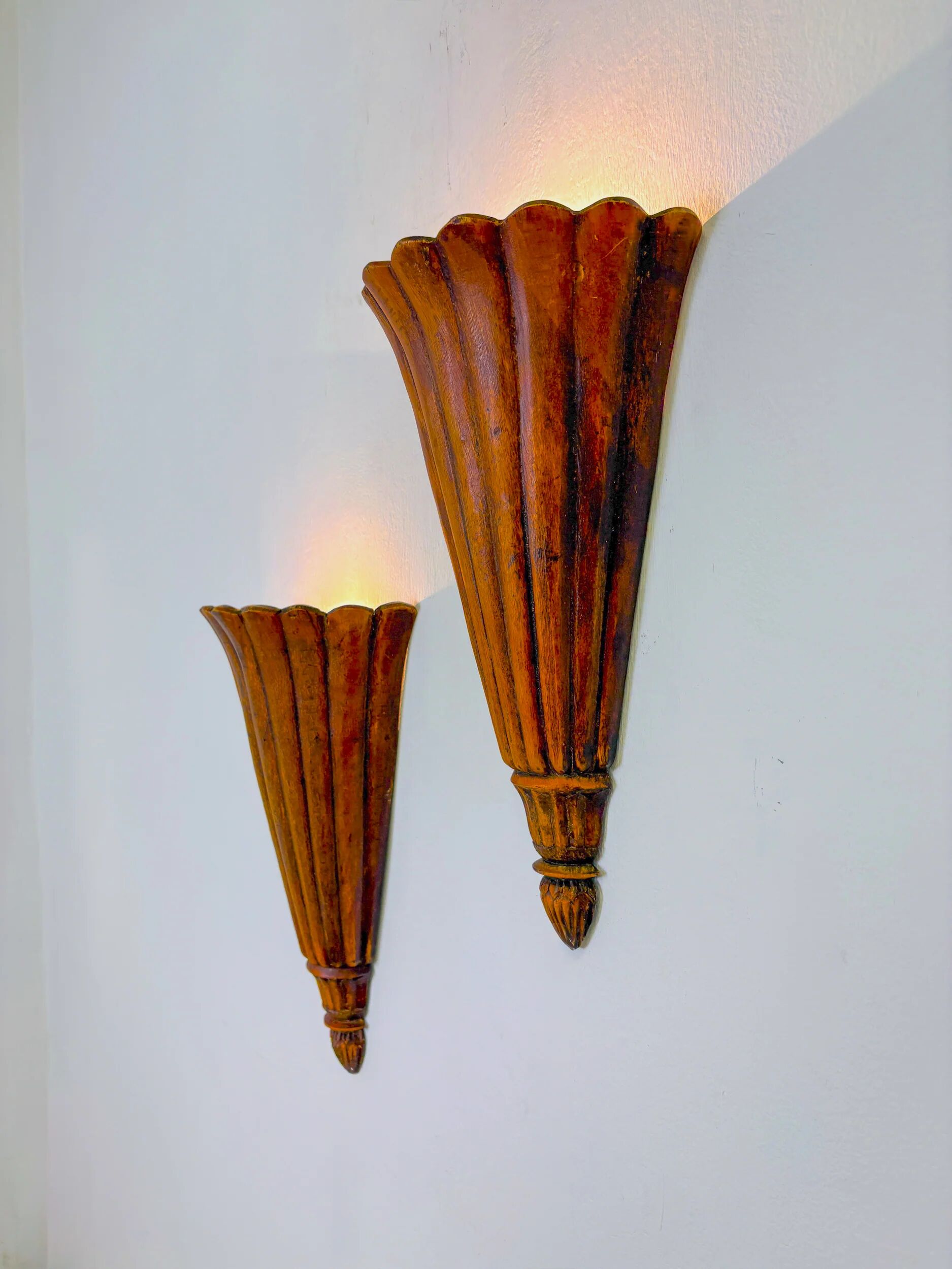 Pair of Art Deco carved wood wall sconces, France, 1930s