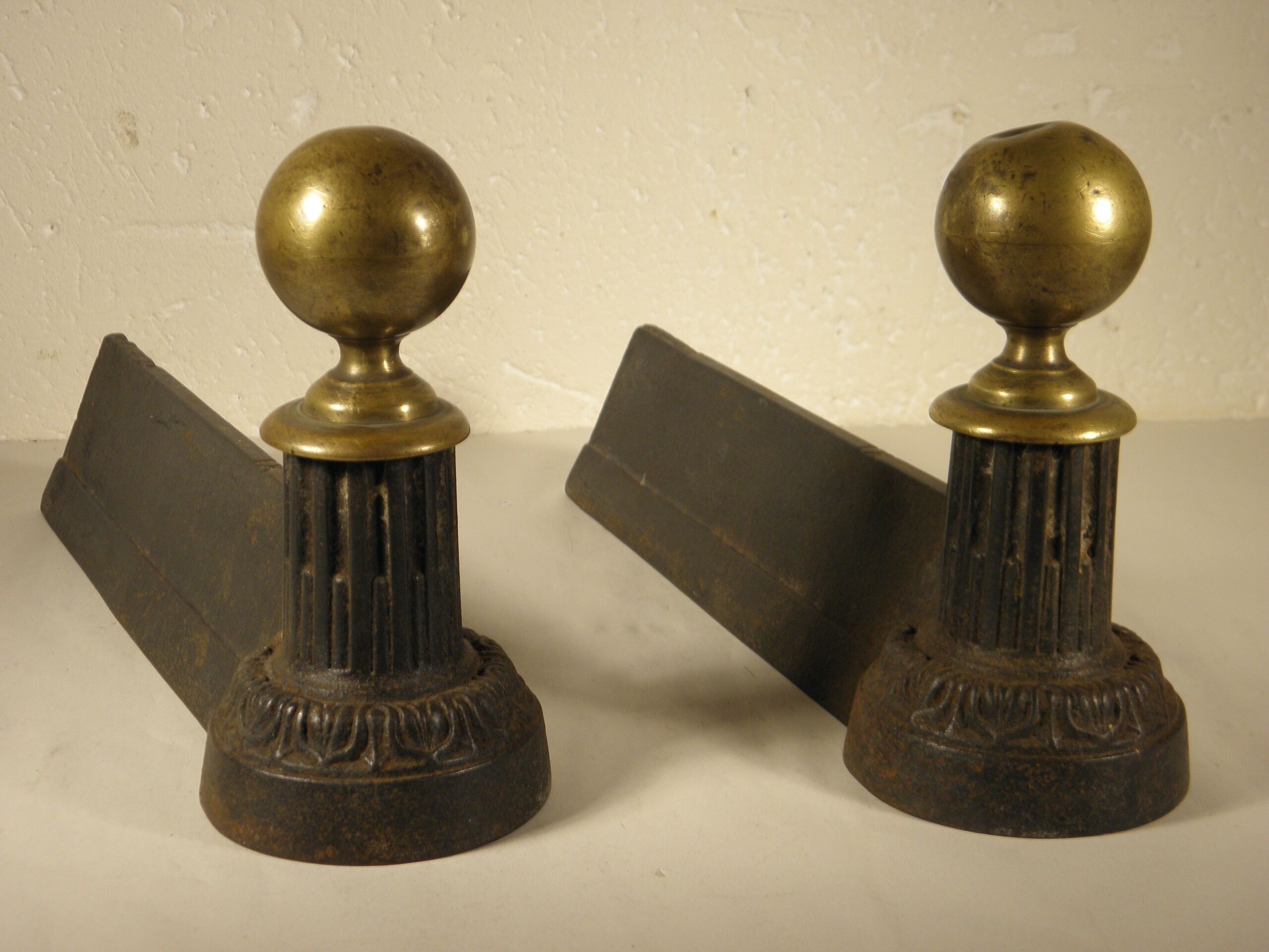 Pair of cast iron and brass chenets