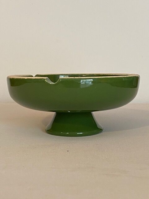 Vintage green ashtray on foot