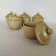 Covered tea bowls in CNP Village sandstone