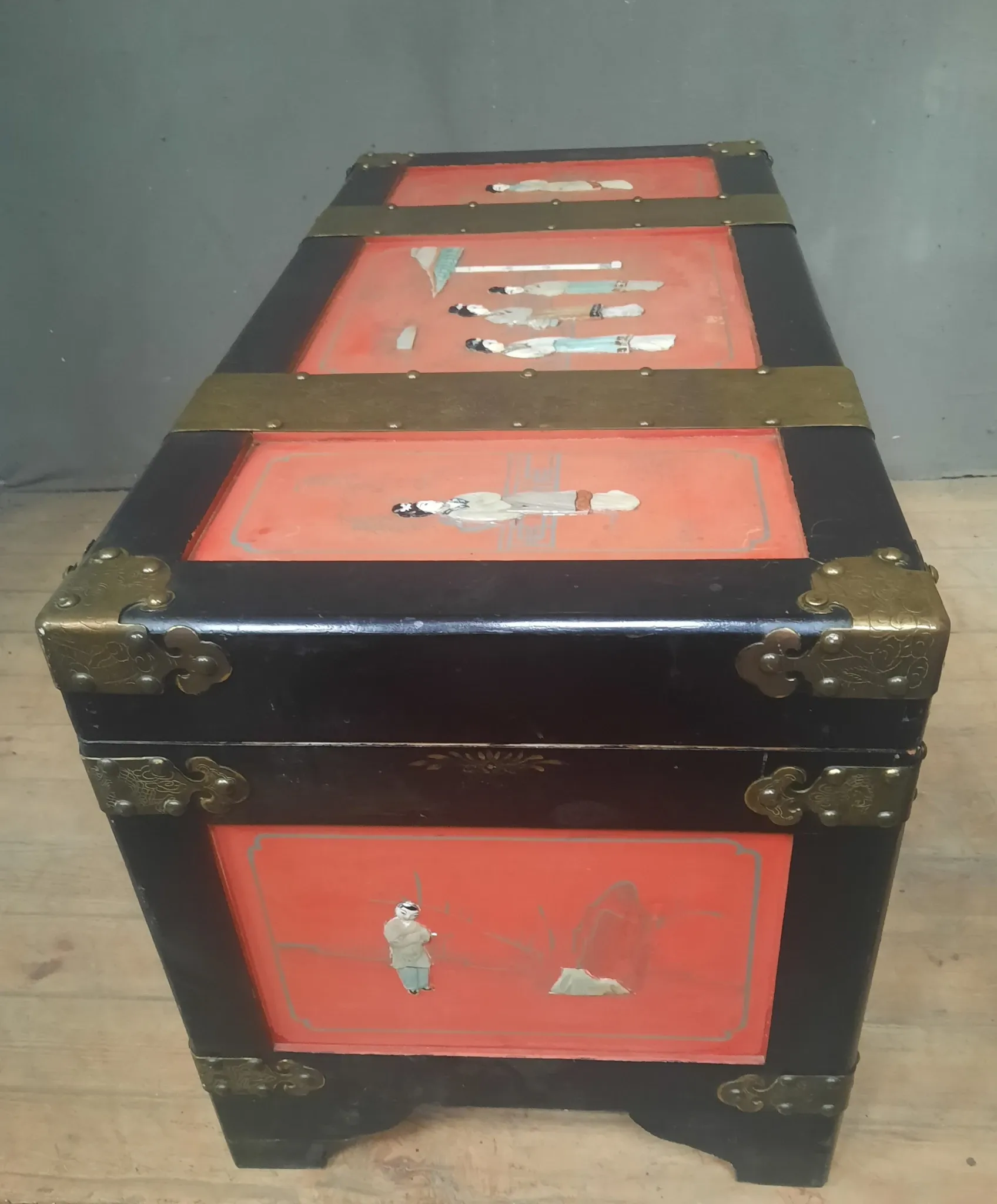 Red lacquered wooden mallet from the Far East.