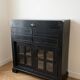 Black wooden sideboard with glass doors – industrial/vintage style