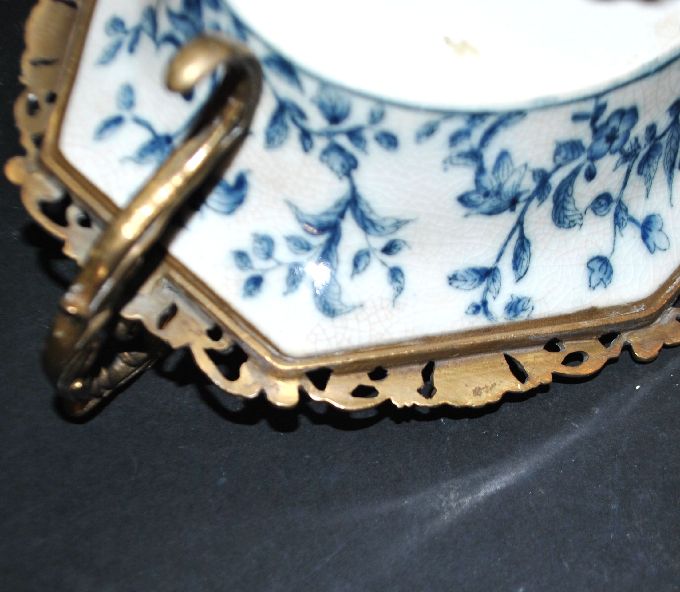Blue Chinese floral porcelain coupe on a bronze base table centrepiece.