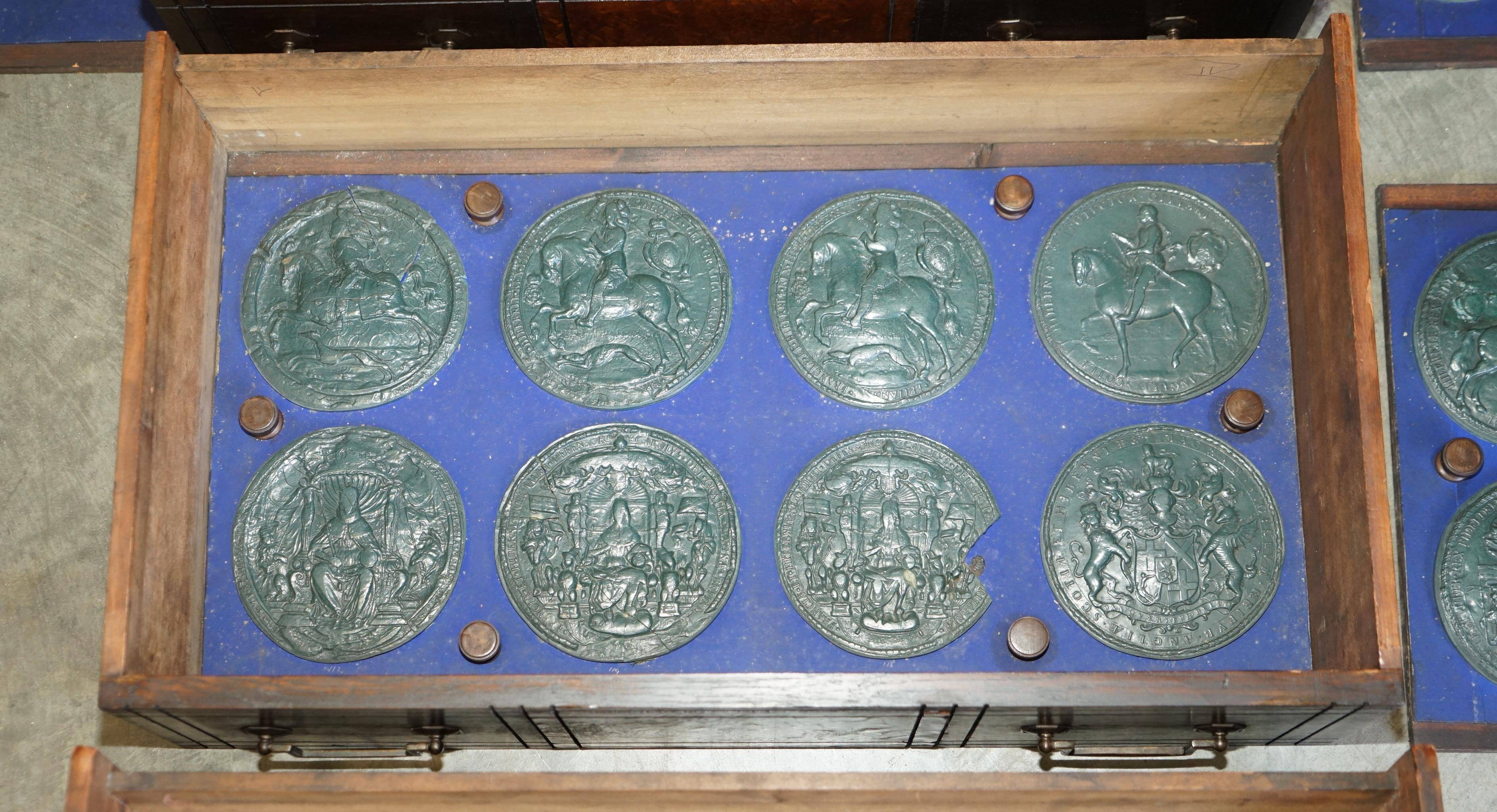 Victorian Wellington chest in figured elm by R Crosby & Son with 160 seal impressions.