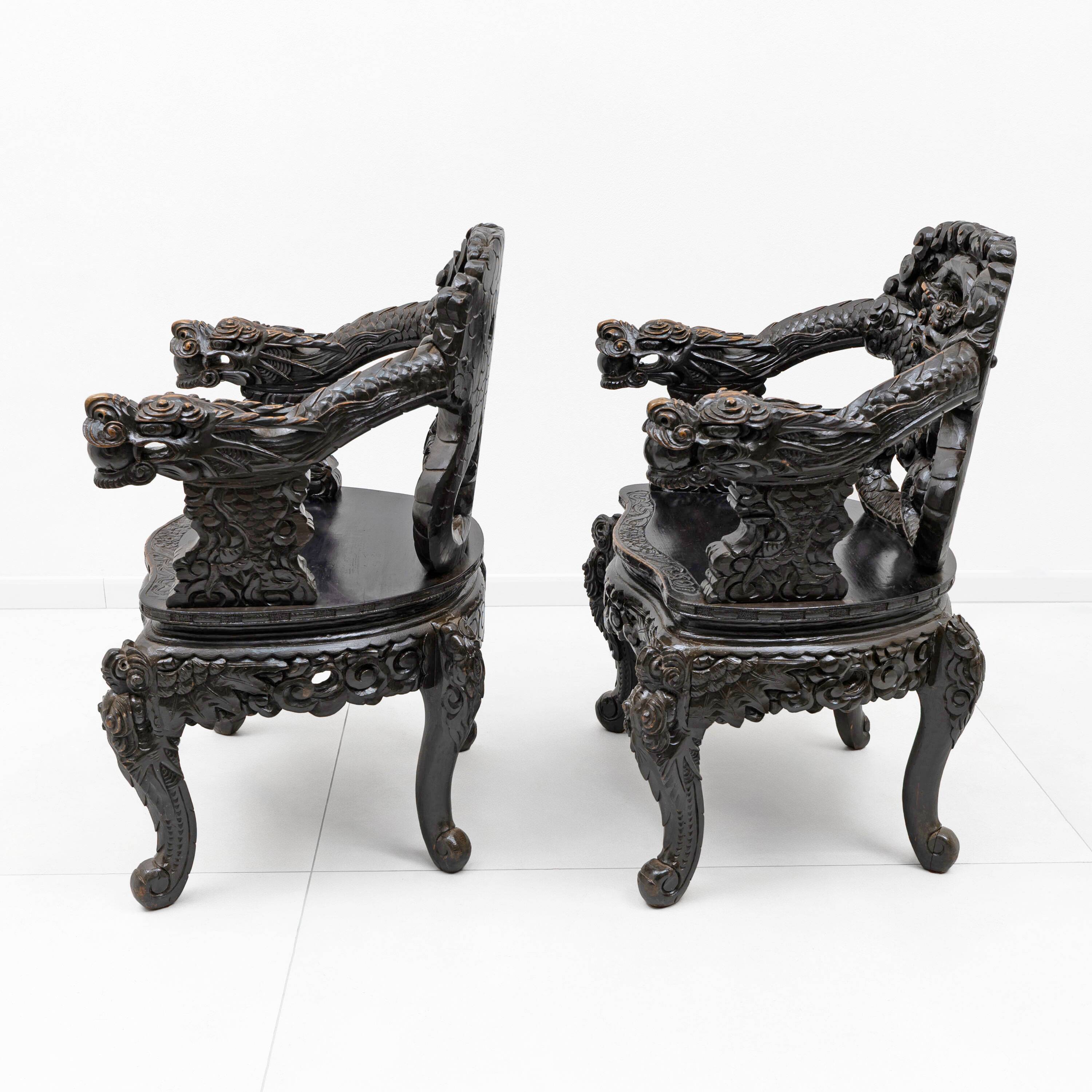 Pair of Chinese Qing Dynasty Carved Dragon Armchairs,Ebonized Hardwood,19th