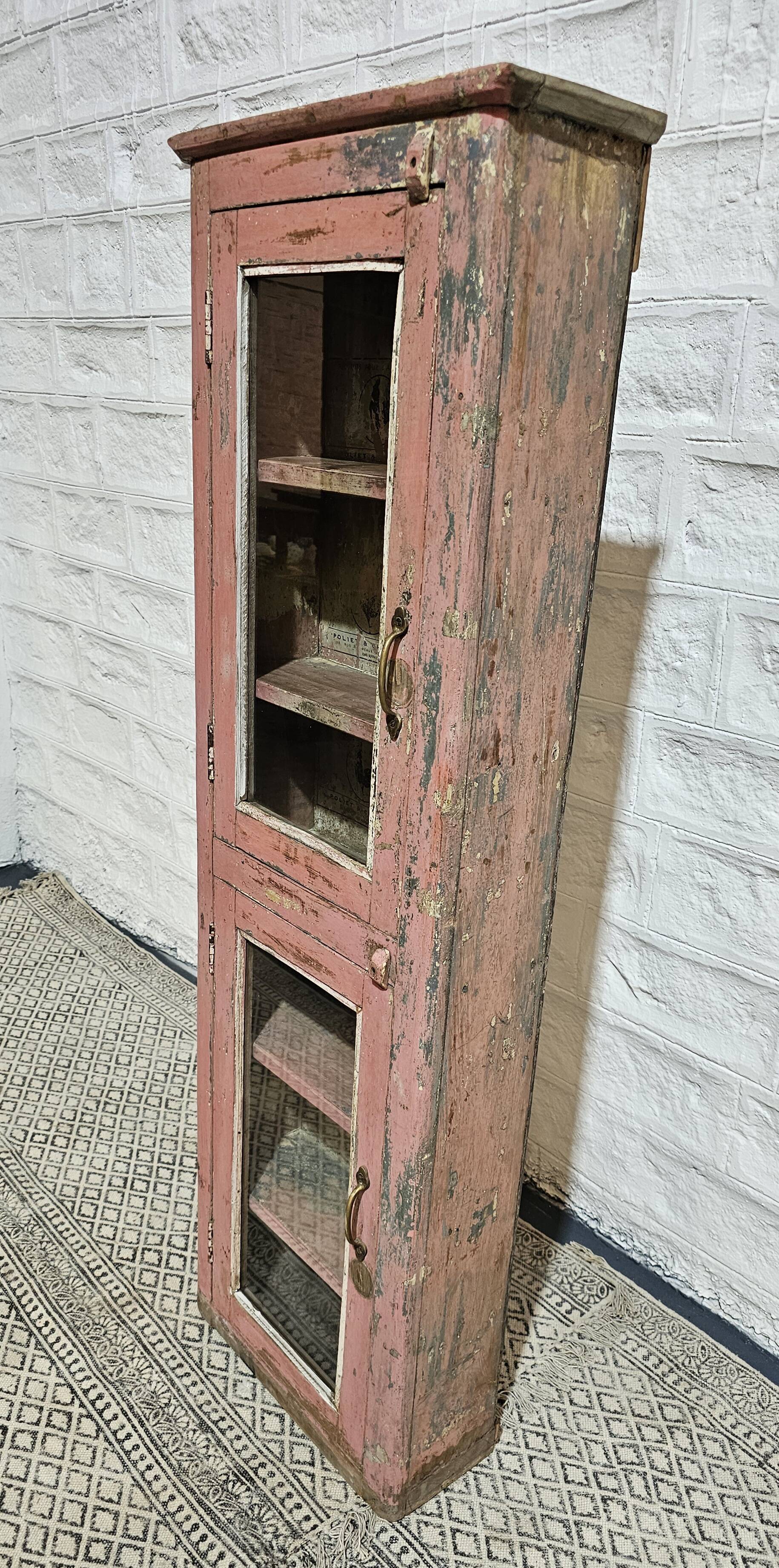 Pink showcase in Burmese teak